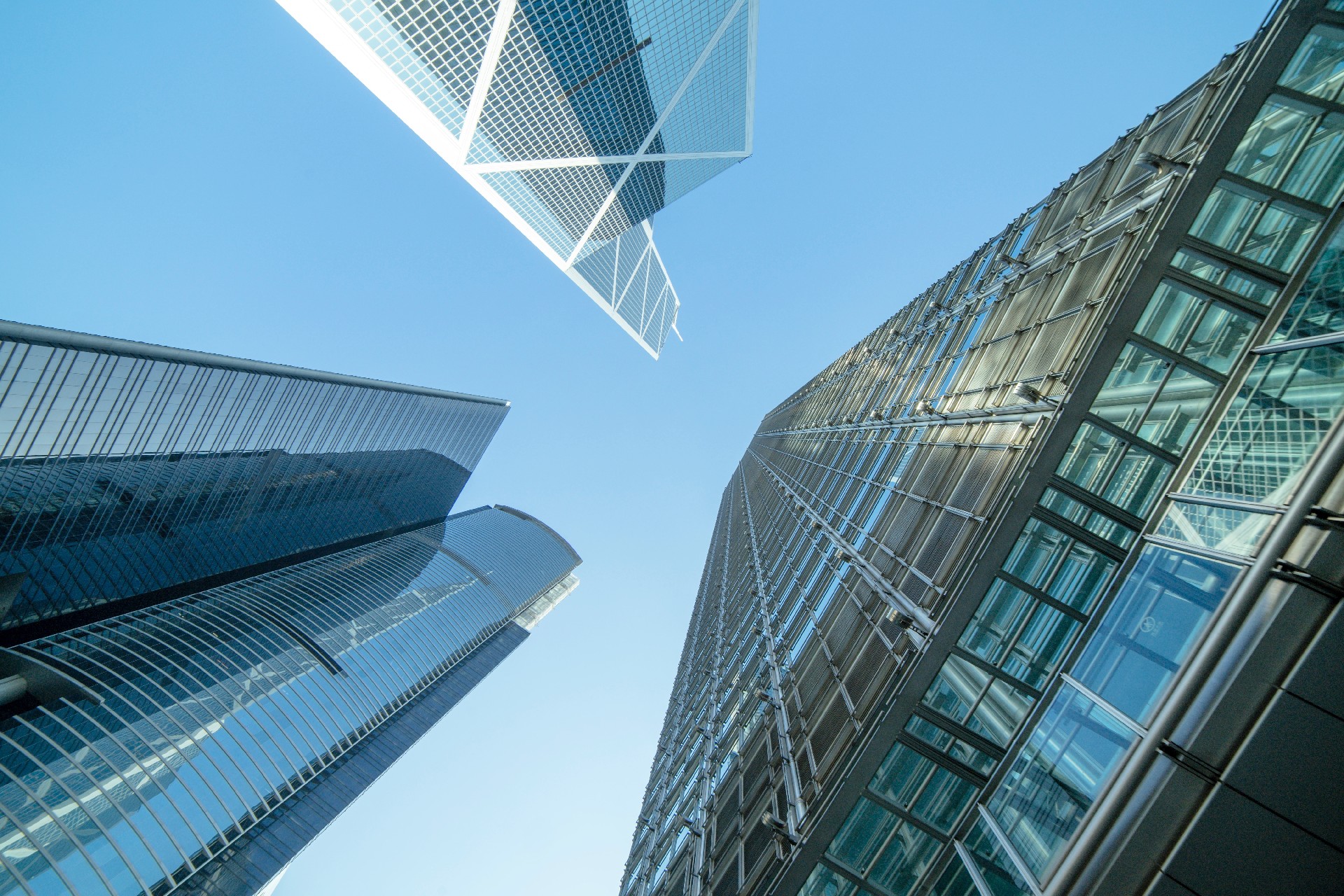 low-angle-photography-of-buildings-under-blue-and-white-sky-998499.jpg